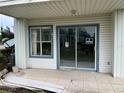 Condo patio with sliding glass doors and a 