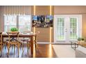 Dining area with large table, unique lighting, and TV at 2901 Edenshire Way # 104, Kissimmee, FL 34746