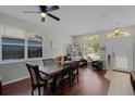 Dining room with hardwood floors, table and access to the kitchen at 842 Cherry Valley Way, Orlando, FL 32828