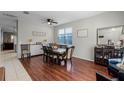 Spacious dining room with hardwood floors and a large table at 842 Cherry Valley Way, Orlando, FL 32828
