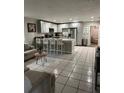Modern kitchen featuring white shaker cabinets, stainless steel appliances, and an island at 1704 Osceola Park Dr, Kissimmee, FL 34741