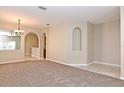 Spacious dining area with neutral walls and carpeting at 1205 Longville Cir, Tavares, FL 32778