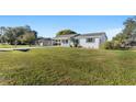 Newly renovated home with a spacious lawn at 2588 Sun Acres Blvd, Auburndale, FL 33823