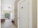 Hallway with storage unit and exit stairs at 3725 Conroy Rd # 2131, Orlando, FL 32839