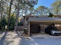 Condo building with carport parking and mature trees at 5308 Pebble Beach Dr # F-01-1, Orlando, FL 32811
