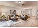 Open living room and dining area with tile floors and neutral decor at 6098 Galloping Dr, Apopka, FL 32712