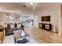 Open living area with kitchen views, tile floors and contemporary furnishings at 6102 Galloping Dr, Apopka, FL 32712