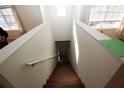 Indoor view of wooden stairs leading to the lower level at 825 Grand Regency Pointe # 200, Altamonte Springs, FL 32714