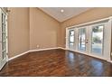 Gathering room with wood-look floors and glass doors that open to the pool area at 1006 Aviles Ct, Oviedo, FL 32765