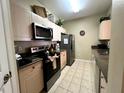 Kitchen with stainless steel appliances and granite countertops at 2306 Silver Palm Dr # 103, Kissimmee, FL 34747