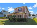 Attractive two-story residence with a landscaped front yard at 2731 Flintlock Ave, Clermont, FL 34711