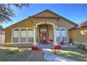 Front view of home with covered entryway and decorative columns at 684 Yorkshire Dr, Oviedo, FL 32765