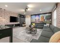 Themed living room featuring Disney artwork, comfortable seating, and a foosball table at 1671 Kona Ln, Davenport, FL 33897