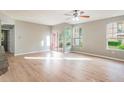 Spacious living room featuring hardwood floors and lots of natural light at 2015 Erving Cir # 108, Ocoee, FL 34761