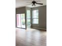 Living room with hardwood floors and access to a balcony at 2015 Erving Cir # 108, Ocoee, FL 34761