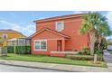 Two-story coral home with pool and lush landscaping at 4756 Ormond Beach Way, Kissimmee, FL 34746