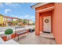 Front entry with a bench and potted plants at 4756 Ormond Beach Way, Kissimmee, FL 34746