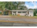 Home with covered carport and walkway to front porch at 507 Orange Ave, Ocoee, FL 34761