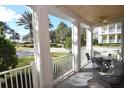 Screened porch overlooking a community with palm trees at 7503 Mourning Dove Cir # 104, Kissimmee, FL 34747