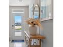 Bright entryway with console table, mirror, and pampas grass at 1210 Balsam Dr, Davenport, FL 33837