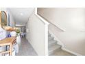 Modern staircase leading to the upper level of the home at 1210 Balsam Dr, Davenport, FL 33837