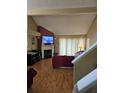Spacious living room featuring a fireplace and hardwood floors at 3563 S Saint Lucie Dr, Casselberry, FL 32707