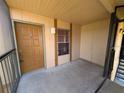 Condo balcony with door, window and storage at 4818 S Semoran Blvd # 508, Orlando, FL 32822