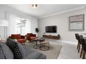 Cozy living room featuring neutral tones and comfortable seating at 4241 Paragraph Dr, Kissimmee, FL 34746