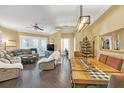 Open dining area with a rustic farmhouse table and hardwood floors at 513 Mirasol Cir # 101, Celebration, FL 34747