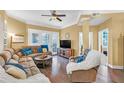 Spacious living room featuring a sectional sofa and hardwood floors at 513 Mirasol Cir # 101, Celebration, FL 34747