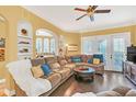 Spacious living room with hardwood floors and comfortable seating at 513 Mirasol Cir # 101, Celebration, FL 34747