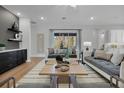 Spacious living room with hardwood floors and cozy furniture at 14279 Crest Palm Ave, Windermere, FL 34786
