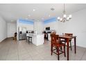 Modern kitchen with stainless steel appliances and an island at 2362 Lancashire St, Davenport, FL 33896