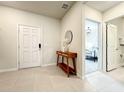 Home entryway with a mid-century modern console table and view of bedroom at 4190 Lana Ave, Davenport, FL 33897