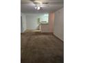 Open living room and kitchen area with carpeted floors at 4308 S Kirkman Rd # 1707, Orlando, FL 32811