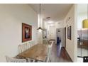 Dining area with wooden table, white chairs, and view of the entryway at 605 Rum Run # 605, Davenport, FL 33837