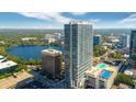 Modern high-rise building overlooking a lake and city at 150 E Robinson St # 2801, Orlando, FL 32801