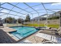 Private pool and spa with screened enclosure at 1528 Mulligan Blvd, Davenport, FL 33896