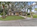 Single-story home with a welcoming front entrance and landscaped yard at 502 N Noel Ct, Chuluota, FL 32766