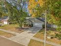 High angle view of a single-story home, driveway, and street at 5416 Higgins Way, Orlando, FL 32808