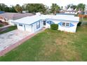 Ranch-style home with a white and blue exterior at 1013 Carlson Dr, Orlando, FL 32804