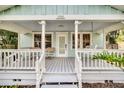 Inviting front porch with rocking chairs and a porch swing at 1550 Indiana Ave, Winter Park, FL 32789