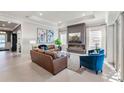 Inviting living room with plenty of natural light, fireplace, and comfortable furniture at 6535 Shimmering Shores Ln, St Cloud, FL 34771