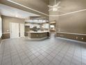 Spacious kitchen with white cabinets, an island, and plenty of counter space at 148 Harwood Cir, Kissimmee, FL 34744
