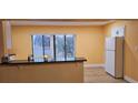 Bright kitchen features a breakfast bar, modern appliances, and tile flooring at 1859 Lake Hill Cir, Orlando, FL 32818
