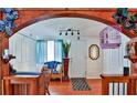 Bright entryway with wood accents and access to other rooms at 431 Perdita Ave, Edgewater, FL 32132