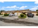 Community of tan townhomes with garages and parking at 707 Carpenters Way # 45, Lakeland, FL 33809