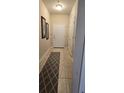 Entryway with tiled floor and a patterned rug at 8252 Civita Dr # 201, Davenport, FL 33896