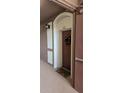 Condo entrance with a festive wreath and welcome mat at 8252 Civita Dr # 201, Davenport, FL 33896