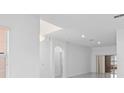 Bright living area with recessed lighting, white walls, and an open floor plan at 686 Cotulla Dr, Kissimmee, FL 34758